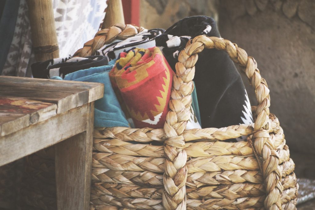 Basket filled with colorful tapestries