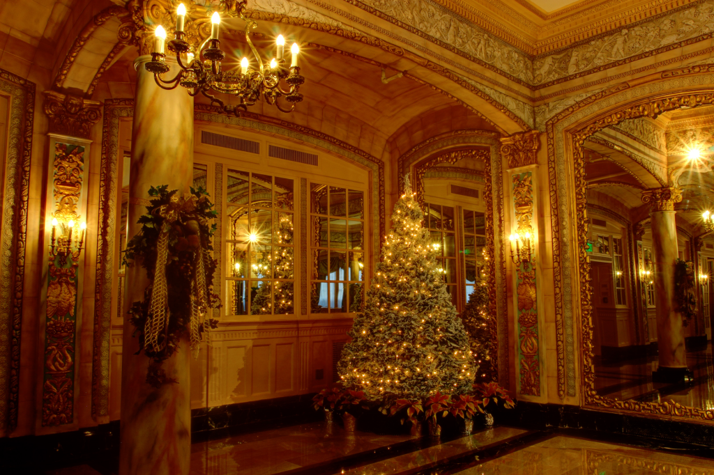 Gold decorated Christmas tree in ornate gold room