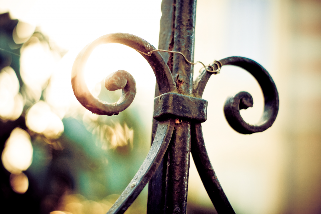 Ornate metal bar with sunlight in background