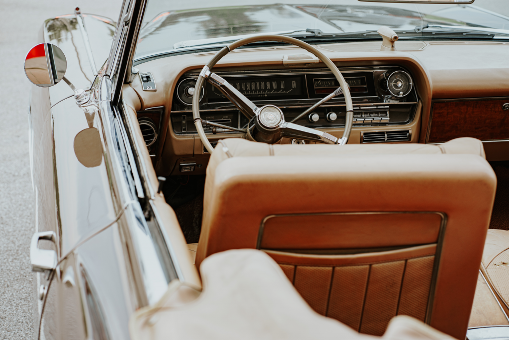 Convertible tan colored car with roof down