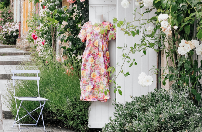 Floral dress hanging outside in front of boutique