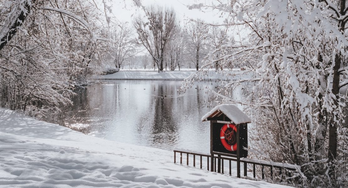 Lake in the winter with red lifesaver