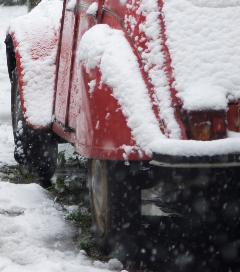 Red car with snow on it