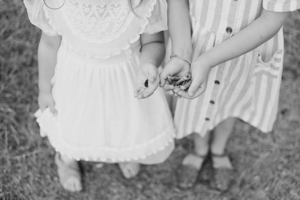 Two girls holding seeds in hands