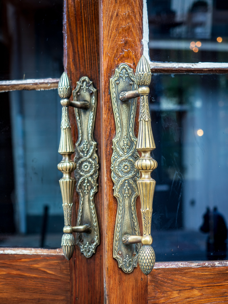 Brass door handles on double doors