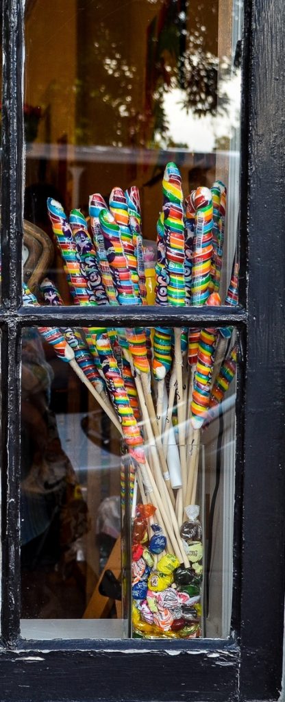 Close up of rainbow colored candy in window