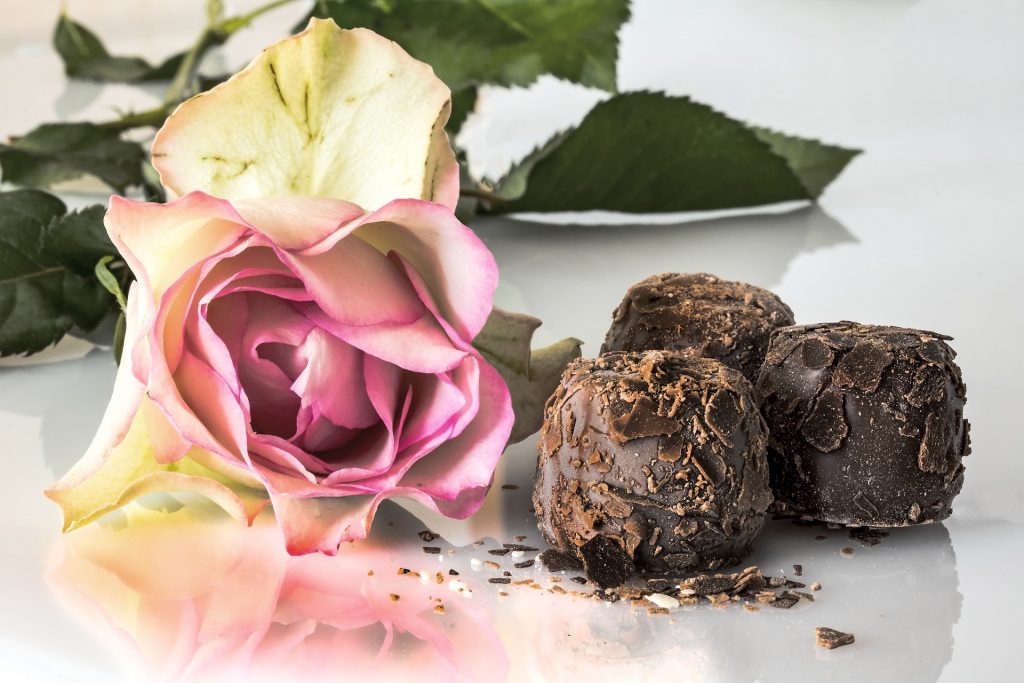 Light pink rose with chocolate truffles